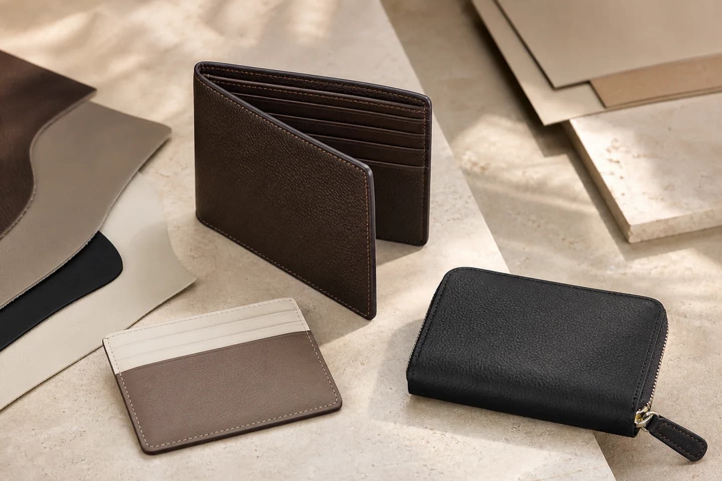 Concept range of custom bifold wallet, cardholder and zip wallet in neutral leather finishes