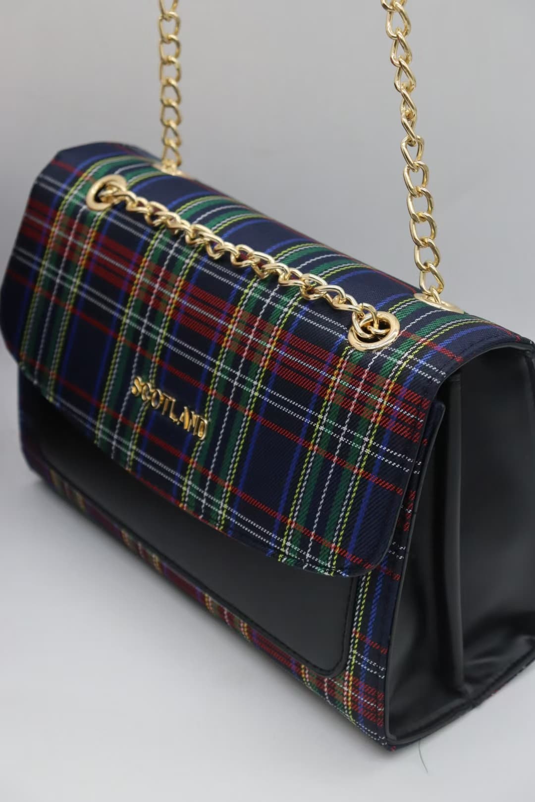 Navy tartan crossbody bag with green and red checks and gold chain hardware