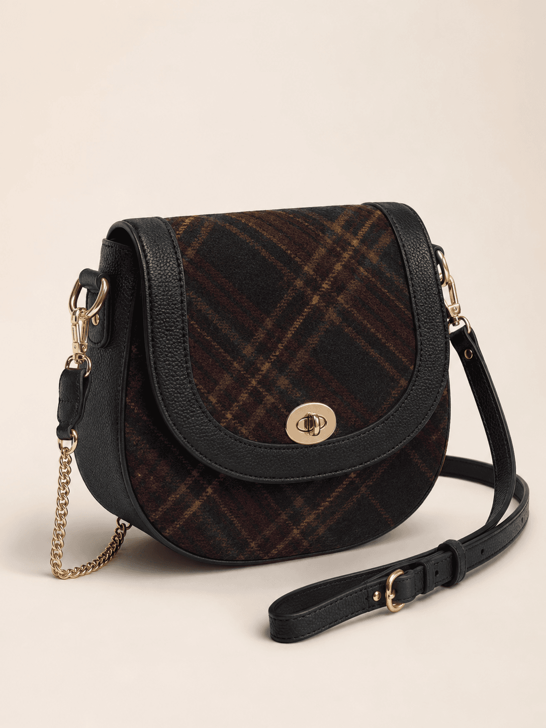 Burgundy tartan saddle crossbody bag with black trim and turn-lock